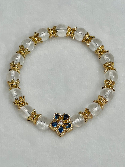 Blue and gold rhinestone bracelet with clear quartz beads.