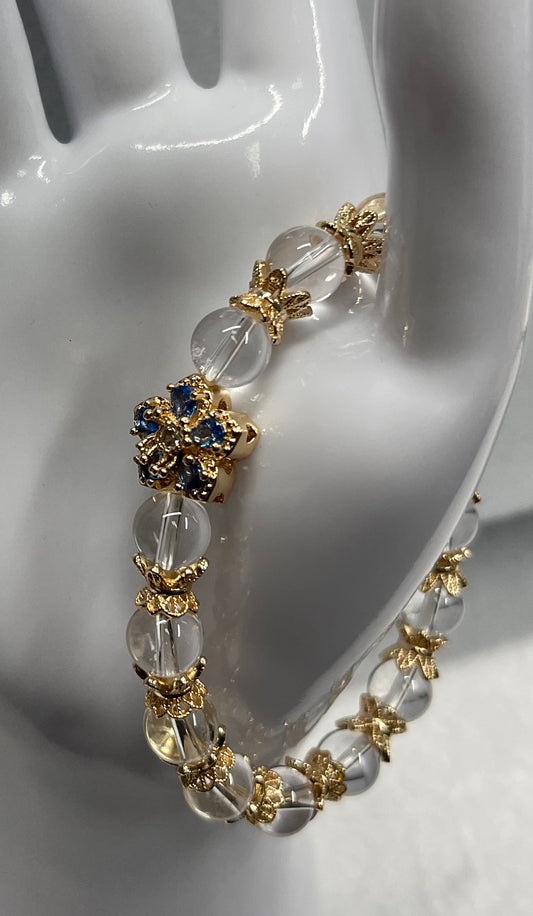 Blue and gold rhinestone bracelet with clear quartz beads.